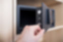 A hand opening secure safe after professional safe installation.