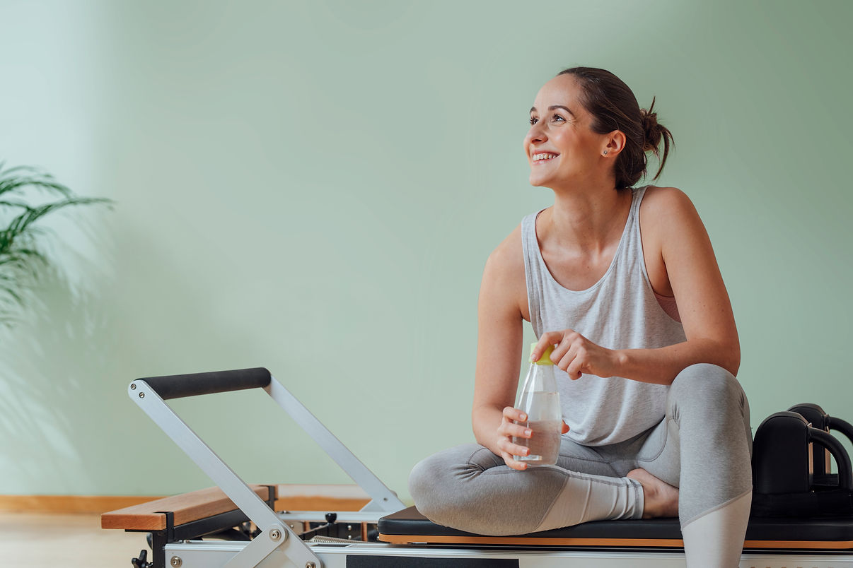 Woman Sitting on Equipment