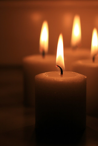 A closeup of a burning candle