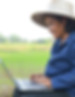 Female farmer using notebook PC
