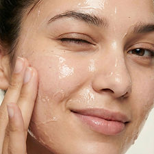 Woman Applying Skincare
