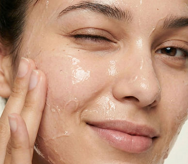 Woman Applying Skincare