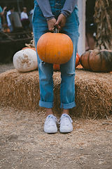 Farmer Holding Pumpkin