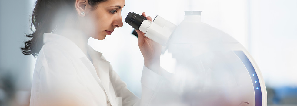Scientist Using Microscope