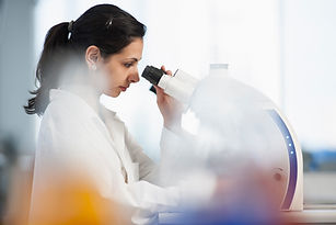 Scientist Using Microscope