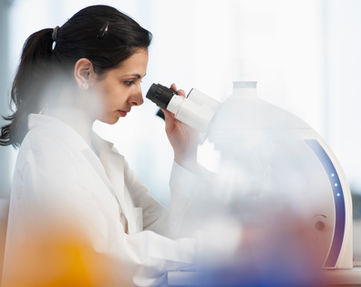 Scientist Using Microscope