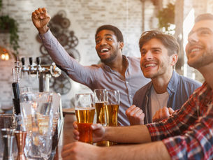 men watching sports at the pub