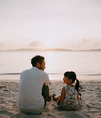 au pair spend time with child on the beach