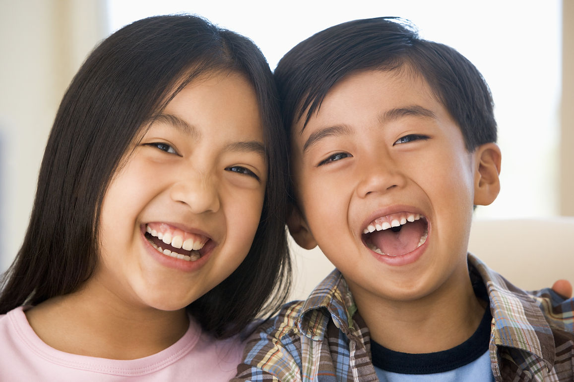 Asian siblings taking a picture