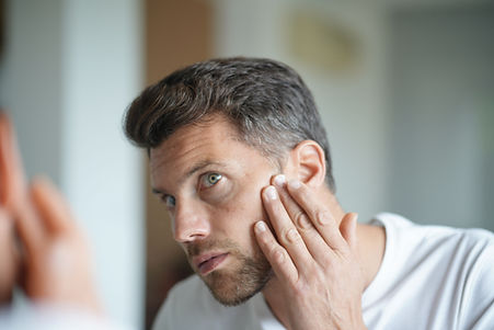 Man Looking in Mirror
