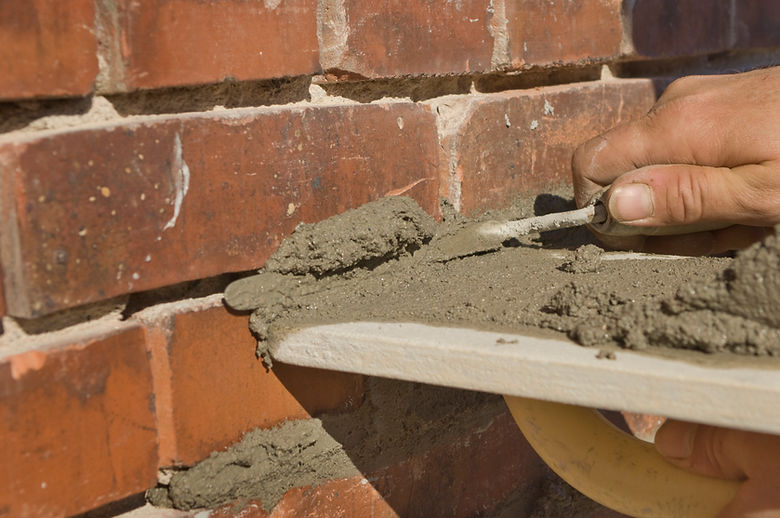 A professional providing repointing services in Newark.