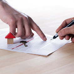 New homeowner signing contract of house sale