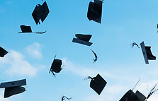 Graduation Caps Flying