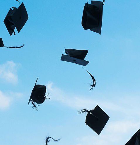Graduation Caps Flying