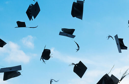 Graduation Caps Flying