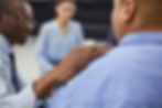 A person supports someone during a training session.