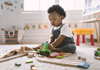 Kid Playing with Wooden Toys