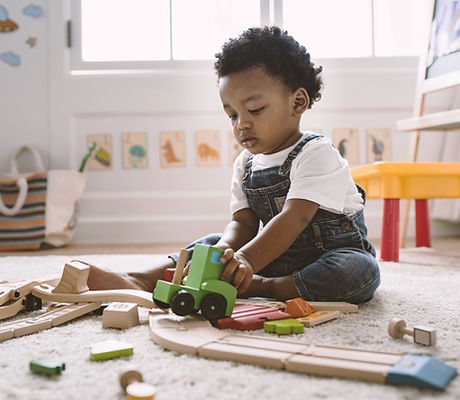 Kid Playing with Wooden Toys