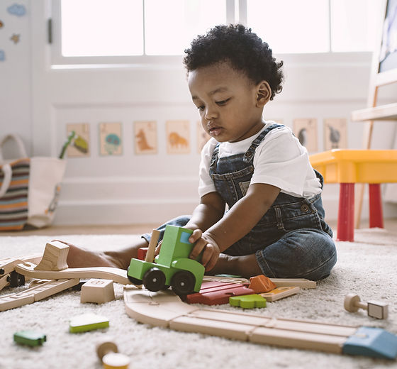 Kid Playing with Wooden Toys