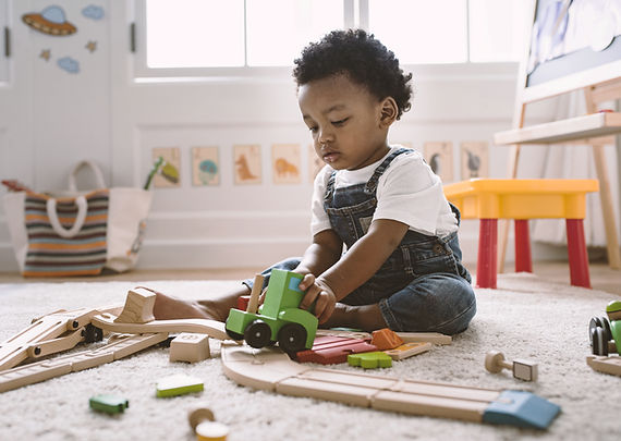 Kid Playing with Wooden Toys