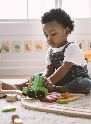 Kid Playing with Wooden Toys