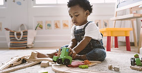 Kid Playing with Wooden Toys