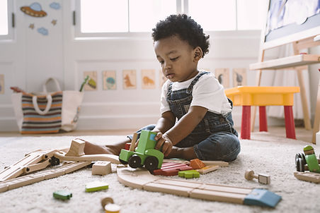 Kid Playing with Wooden Toys