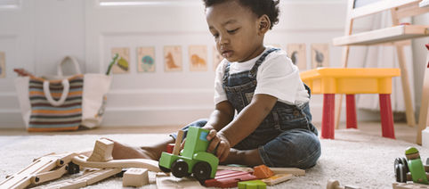 Kid Playing with Wooden Toys