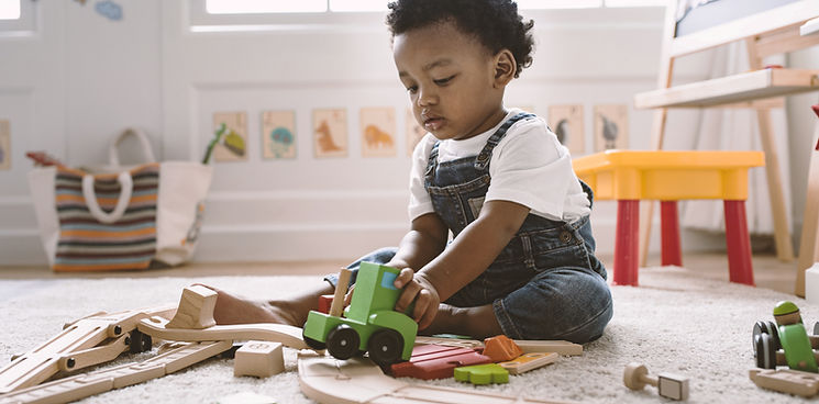 Kid Playing with Wooden Toys
