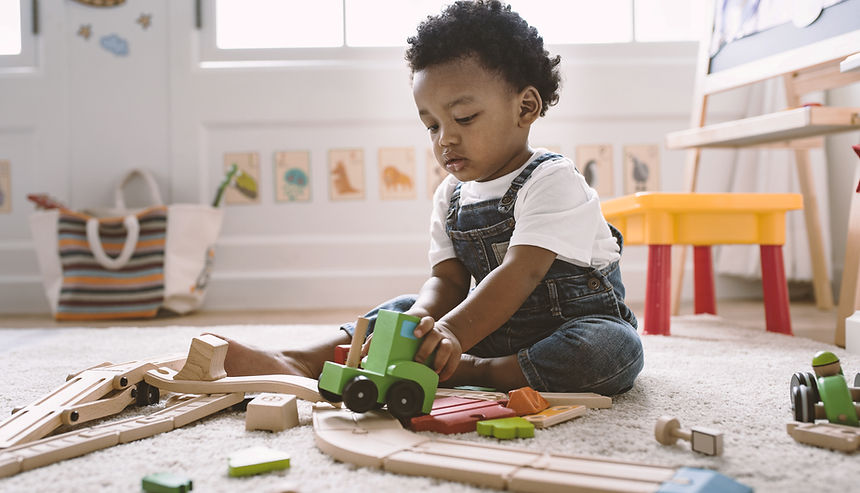 Kid Playing with Wooden Toys