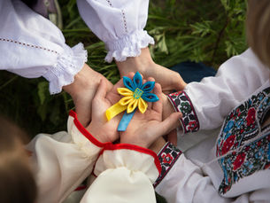 children, holding a flower in ukrainian national flag colors