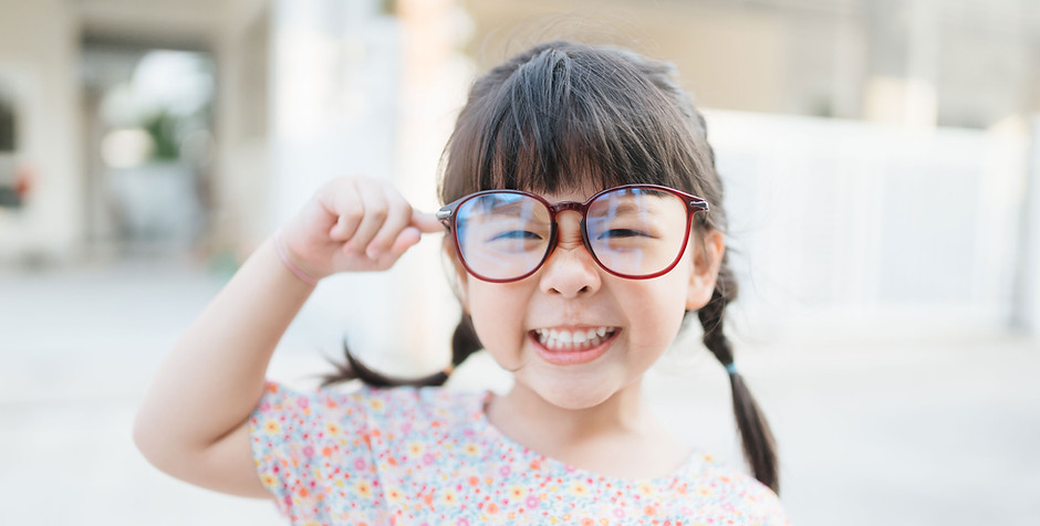 Small Child with Large Glasses