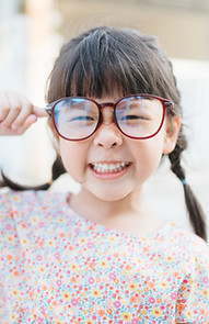Small Child with Large Glasses