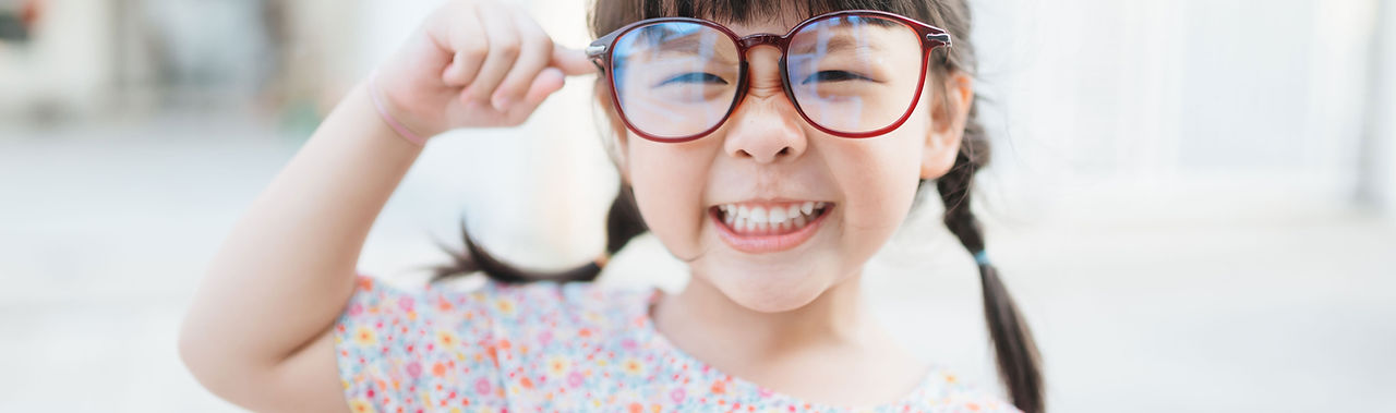 Small Child with Large Glasses