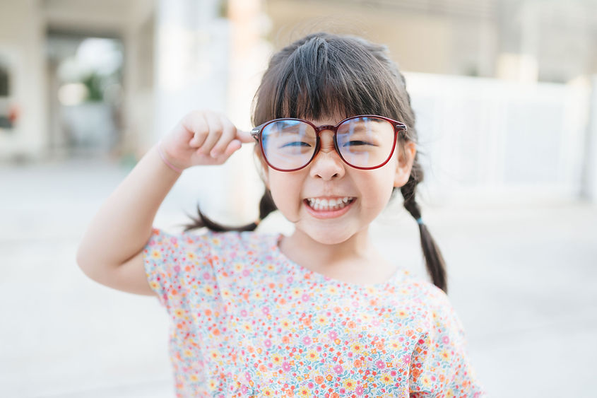 Small Child with Large Glasses