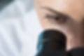 Scientist Using Microscope