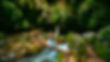 Person crossing wooden bridge