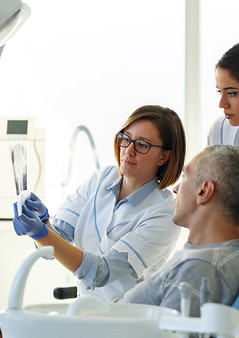 doctor showing X-rays to the patient
