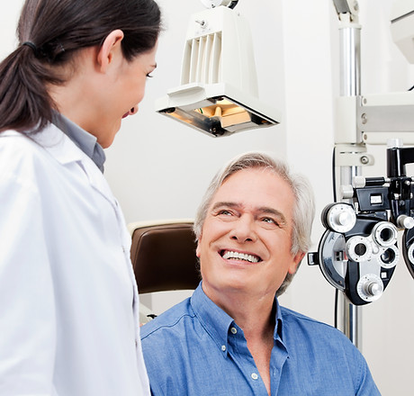 Smiling mature patient consulting with optometrist for an eye checkup