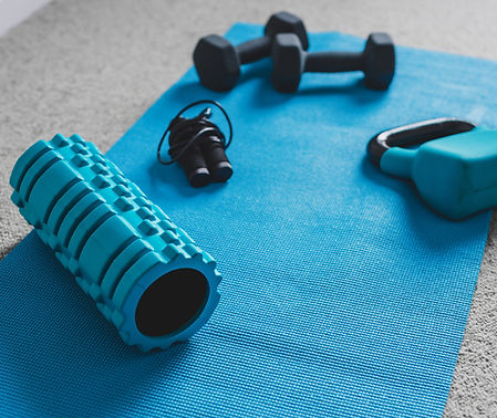 Picture of foam roller and weights for physiotherapy