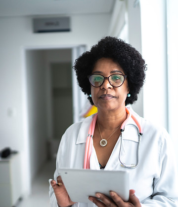 Doctor coming out from consultation and holding an ipad.