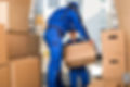 Two professionals handling storage boxes