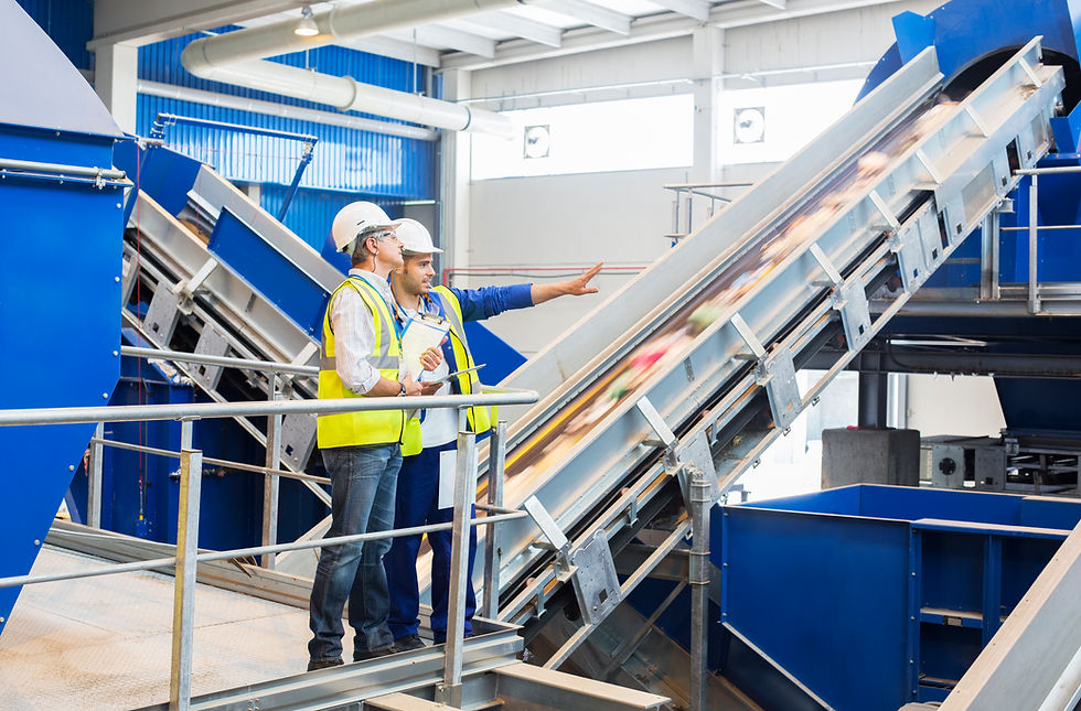 Workers talking in recycling center
