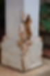 Close up view of termite damage on a outside pillar of a house