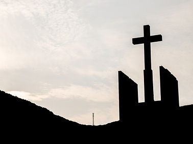 Silhouette of Cross Against Sky
