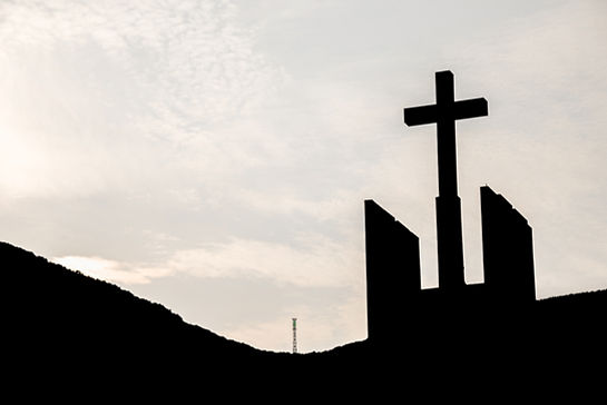 Silhouette of Cross Against Sky