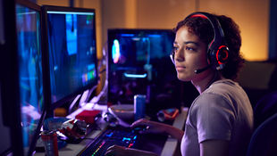 A young woman apprentice working in the gaming industry