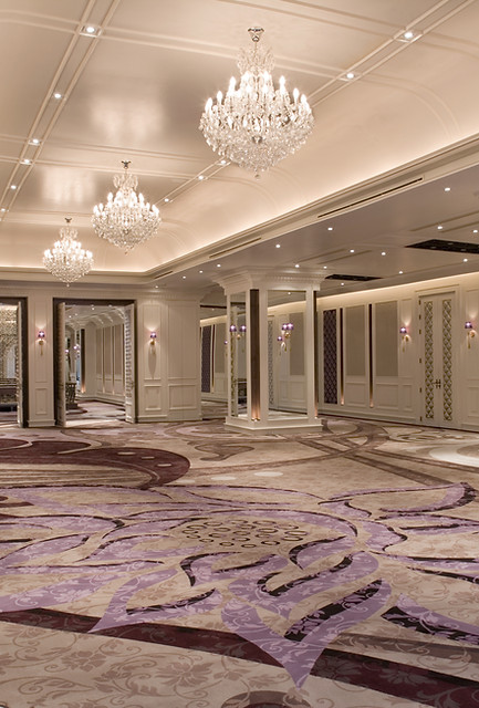 Luxury ballroom with chandeliers and floral carpet