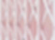 Close-up of a pink lattice gate with diagonal white lines creating a crisscross pattern