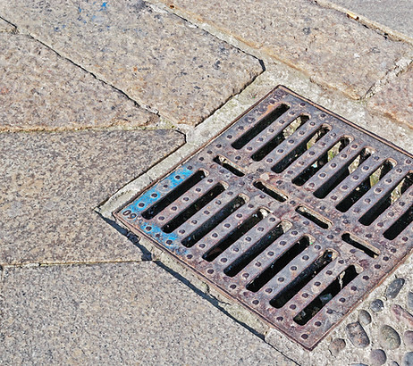 sewer cover in a paved street